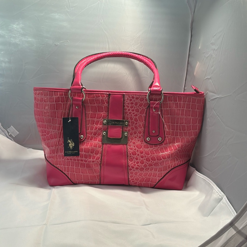 Nice Brand new pink crocodile print purse .